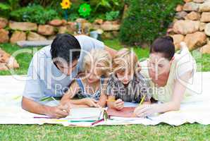 Happy family painting in a park