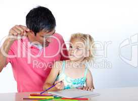 Dad and daughter doing homework together