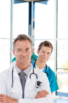 Young doctor in focus in a line