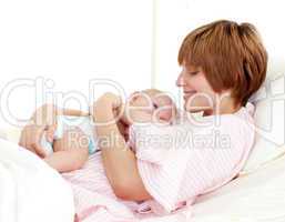 Patient and newborn baby in bed