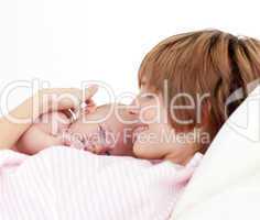 Beautiful patient with newborn baby in bed