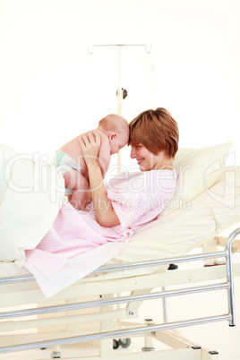 Mother embracing her newborn baby