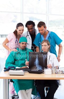 Group of doctors examining an X-ray