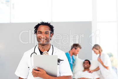 Group of doctors attending to a patient