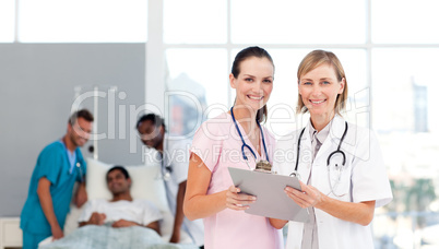 Attractive doctors attending to a patient