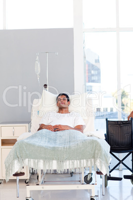 Young patient recovering in bed with copyspace