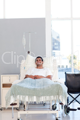 Young patient recovering in bed with copyspace