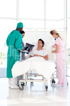 Surgeon and nurses attending to a patient