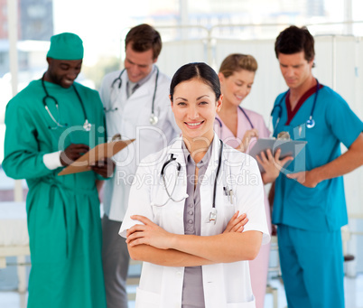 Attractive female doctor with her team