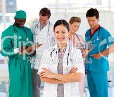 Attractive female doctor with her team