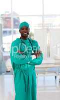 Friendly Afro-American surgeon looking at the camera