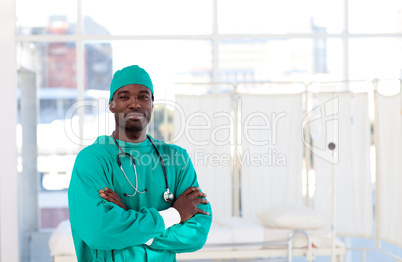Serious Afro-American surgeon with folded arms