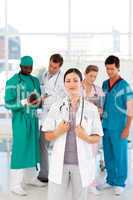 Female doctor with her team in the background