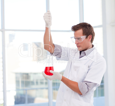 Scientist examinig a test-tube