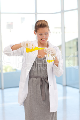 Attractive scientist examining a test-tube