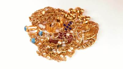 Lots of jewelry in gold rotating