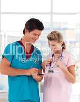 Portrait of doctor with attractive nurse in hospital