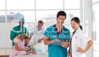 Doctors in a hospital looking after a patient