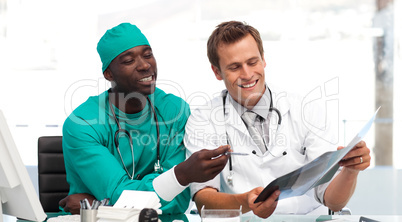doctor and surgeon looking at an xray