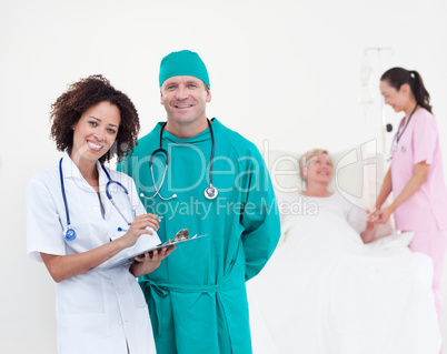 Team of Doctors in a hospital looking after a patient