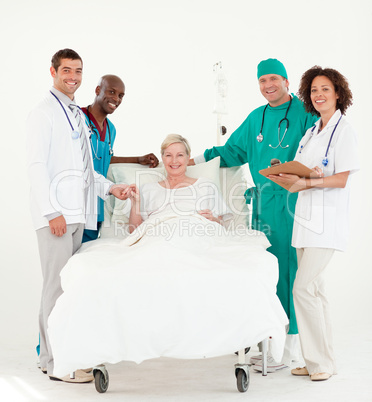 Doctors looking after a patient and bedside