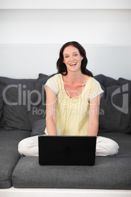 Woman using laptop at home