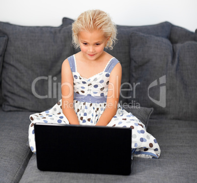 Young girl using a laptop