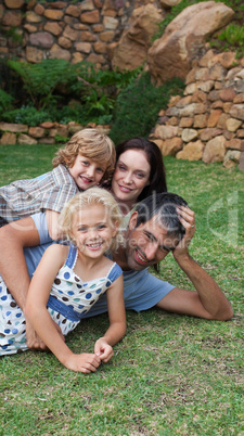 Potrait of a young family in the garden