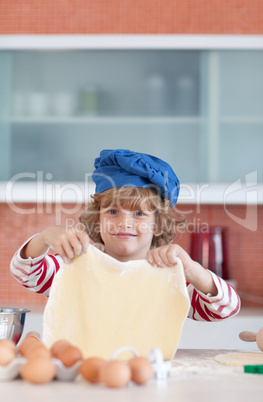 Young boy baking in the kitchen