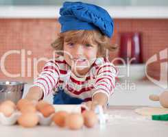 Young boy baking in the kitchen