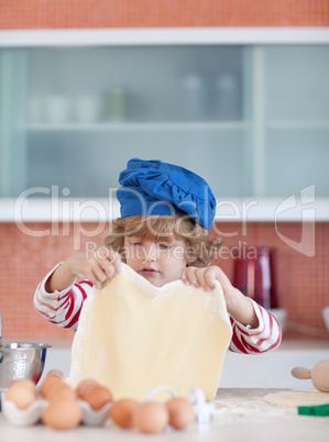 Young boy baking in the kitchen