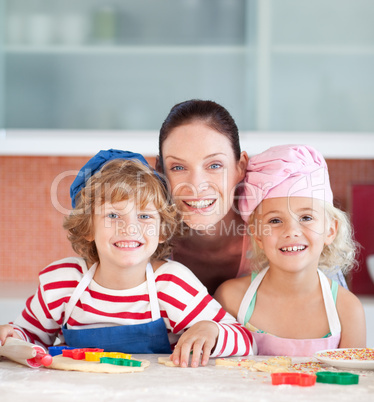 Mother with her Two Kids looking at the camera smiling