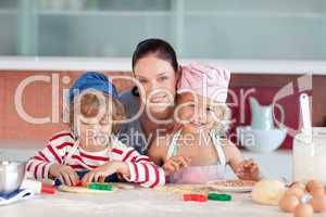 Mother with her Two Kids looking at the camera smiling