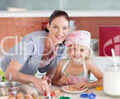 Mother and childing in Kitchen Smiling at Camera