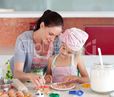 Potrait of money and Daugether in Kitchen Baking