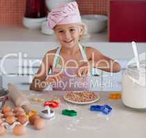 Beautiful young Girl Working in the Kitchen