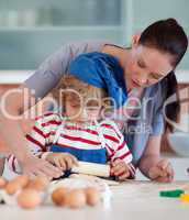 Mother and child doing Christmas baking