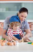 Mother and child doing Christmas baking