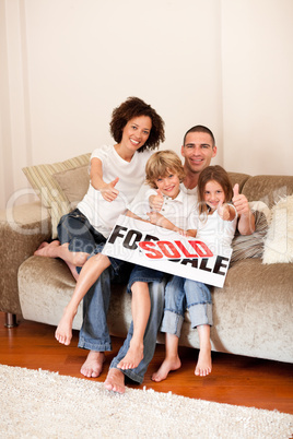 Family relaxing on sofa