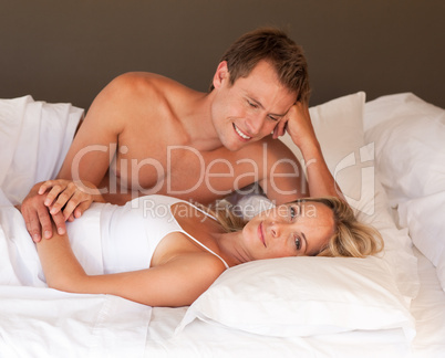 Intimate young couple on bed