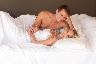 Intimate young couple on bed