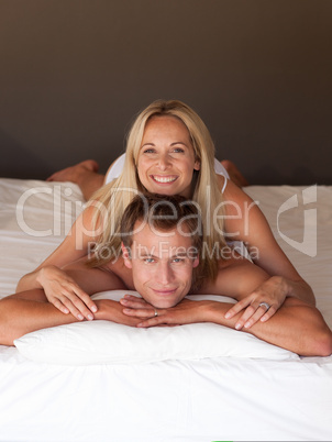 Couple on bed smiling