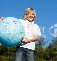 Boy holding a globe