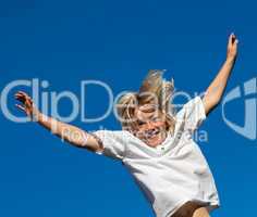 Boy Jumping on a trampoline