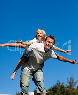 Child on his fathers back