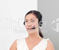 Beautiful International Business woman on a Headset smiling