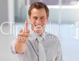 Young Businessman with Thumb up to the camera