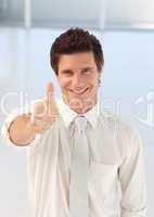 Young Businessman with Thumb up to the camera