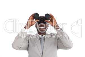 Businessman Looking through binoculars