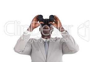 Businessman Looking through binoculars